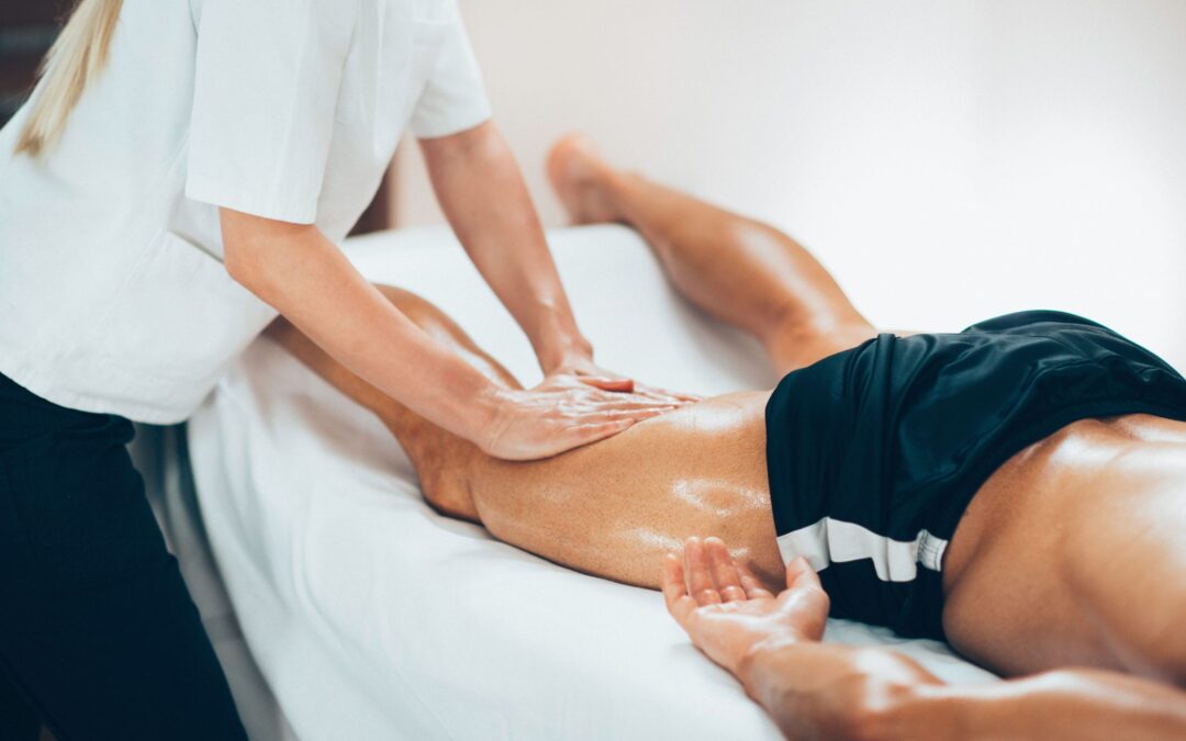 leg-massage-physical-therapyst-massaging-leg-of-yo-PH5C8RS