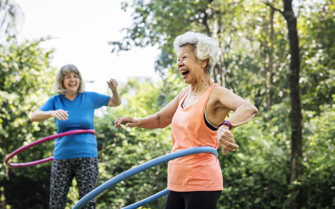 senior-woman-exercising-with-a-hula-hoop-MNTC3P6
